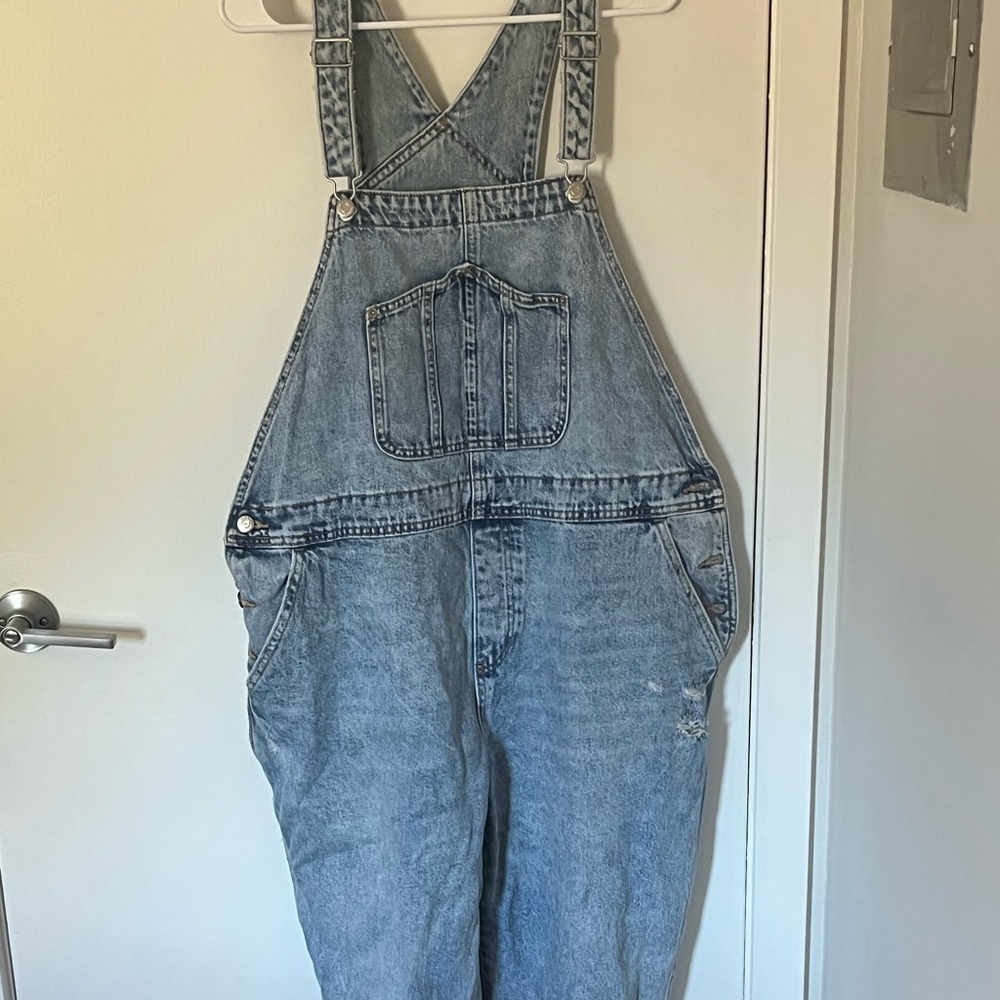 Distressed light denim overalls